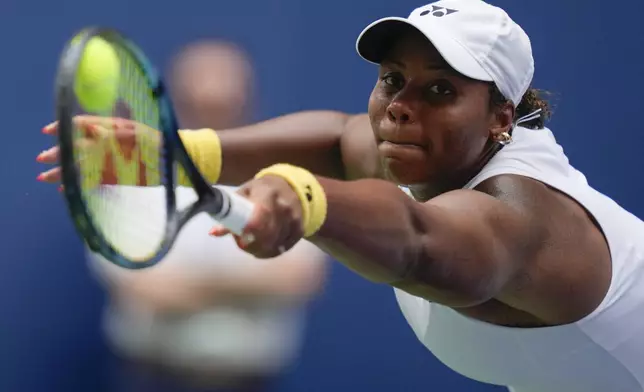 Taylor Townsend, of the United States, lunges for a shot from Paula Badosa, of Spain, during the first round of the U.S. Open tennis championships, Wednesday, Aug. 28, 2024, in New York. (AP Photo/Julia Nikhinson)