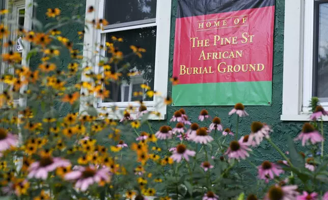 A sign marks the location of a recently rediscovered African burial ground in Kingston, N.Y., Monday, Aug. 5, 2024. (AP Photo/Seth Wenig)