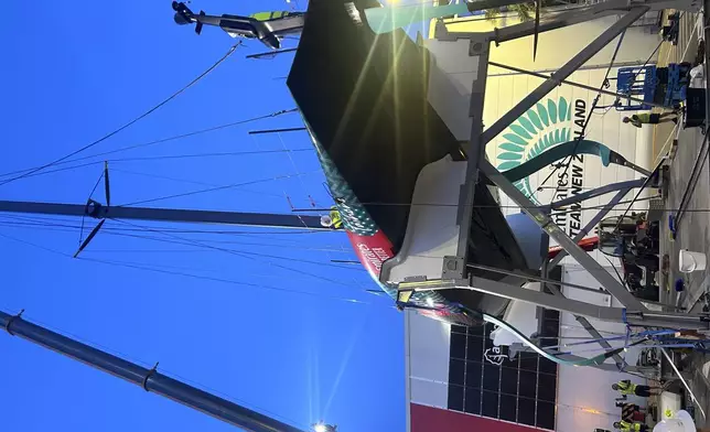 Emirates Team New Zealand’s boat is shown after it was damaged when the crane failed while removing it from the water after racing on the opening day of the 37th America’s Cup in Barcelona, Spain. (AP Photo/Joseph Wilson)