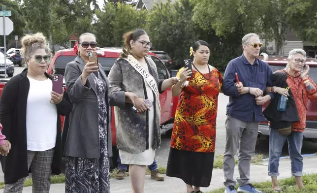 A prayer vigil drew about 100 residents, including members of the American Samoa community, to downtown Anchorage, Alaska, on Friday, Aug. 16, 2024, after police shot and killed 16-year-old Easter Leafa. (AP Photo/Mark Thiessen)