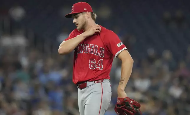 Los Angeles Angels pitcher Jack Kochanowicz walks back to the dug out at the end of fourth inning during a baseball game against Toronto Blue Jays in Toronto, Friday, Aug. 23, 2024. (Chris Young/The Canadian Press via AP)