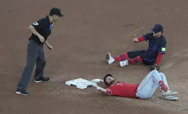 Los Angeles Angels Nolan Schanuel is grounded out at second base by Toronto Blue Jays short stop Ernie Clement during first inning of a baseball in Toronto, Friday, Aug. 23, 2024. (Chris Young/The Canadian Press via AP)