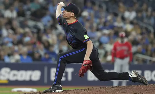 Toronto Blue Jays pitcher Chris Bassitt works against Los Angeles Angels during fifth inning of a baseball game in Toronto on Friday, Aug. 23, 2024. (Chris Young/The Canadian Press via AP)