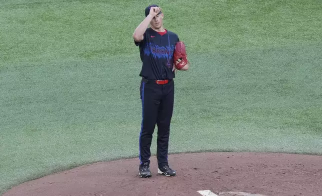 Toronto Blue Jays pitcher Bowden Francis reacts after Los Angeles Angels Taylor Ward hits a single during second inning of a baseball game in Toronto, Friday, Aug. 23, 2024. (Chris Young/The Canadian Press via AP)