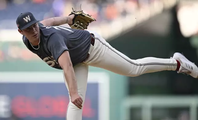 Washington Nationals starting pitcher Mitchell Parker follows through during the first inning of a baseball game against the Los Angeles Angels, Friday, Aug. 9, 2024, in Washington. (AP Photo/John McDonnell)