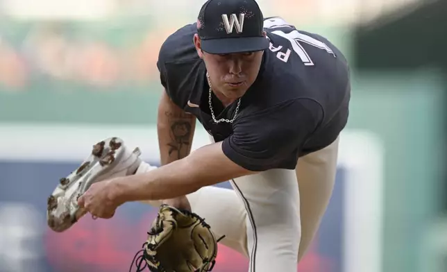 Washington Nationals starting pitcher Mitchell Parker follows through during the first inning of a baseball game against the Los Angeles Angels, Friday, Aug. 9, 2024, in Washington. (AP Photo/John McDonnell)