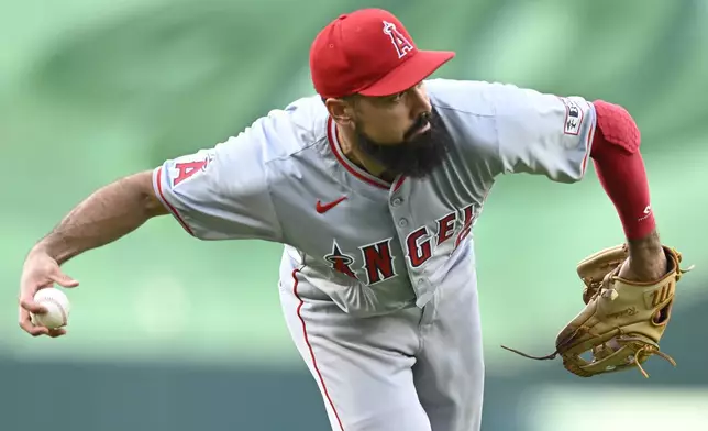 Los Angeles Angels third baseman Anthony Rendon fields a short ground ball on a hit by Washington Nationals' Alex Call during the first inning of a baseball game, Friday, Aug. 9, 2024, in Washington. (AP Photo/John McDonnell)