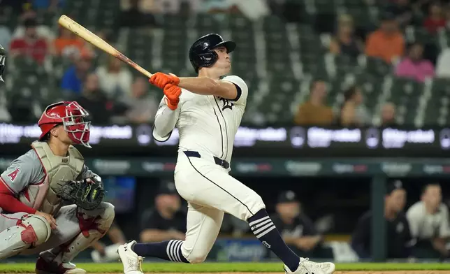 Detroit Tigers designated hitter Kerry Carpenter connects for a two-run home run during the sixth inning of a baseball game against the Los Angeles Angels, Tuesday, Aug. 27, 2024, in Detroit. (AP Photo/Carlos Osorio)