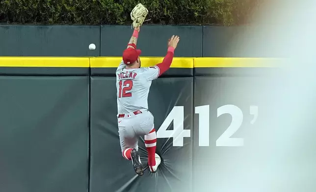 Los Angeles Angels center fielder Kevin Pillar is unable to catch the solo home run hit by Detroit Tigers' Riley Greene during the sixth inning of a baseball game, Tuesday, Aug. 27, 2024, in Detroit. (AP Photo/Carlos Osorio)