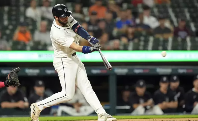 Detroit Tigers' Matt Vierling connects for a RBI double during the fourth inning of a baseball game against the Los Angeles Angels, Tuesday, Aug. 27, 2024, in Detroit. (AP Photo/Carlos Osorio)