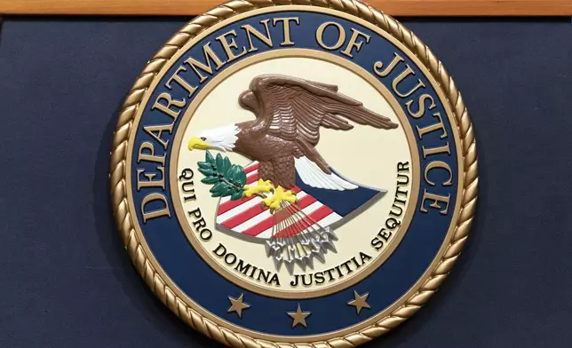 FILE - The Department of Justice seals is seen during a news conference at the DOJ office in Washington, May 16, 2023. (AP Photo/Jose Luis Magana, File)