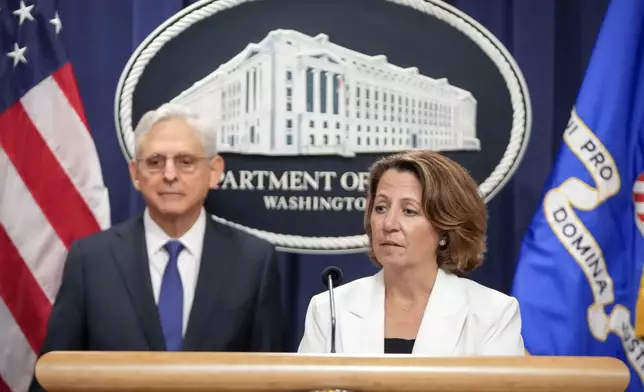 Deputy Attorney General Lisa Monaco speaks with reporters about an antitrust lawsuit against real estate software company RealPage during a news conference at the Department of Justice, Friday, Aug. 23, 2024, in Washington. At left is Attorney General Merrick Garland. (AP Photo/Mark Schiefelbein)