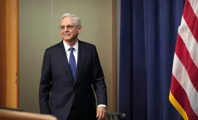 Attorney General Merrick Garland arrives for a news conference about an antitrust lawsuit against real estate software company RealPage at the Department of Justice, Friday, Aug. 23, 2024, in Washington. (AP Photo/Mark Schiefelbein)