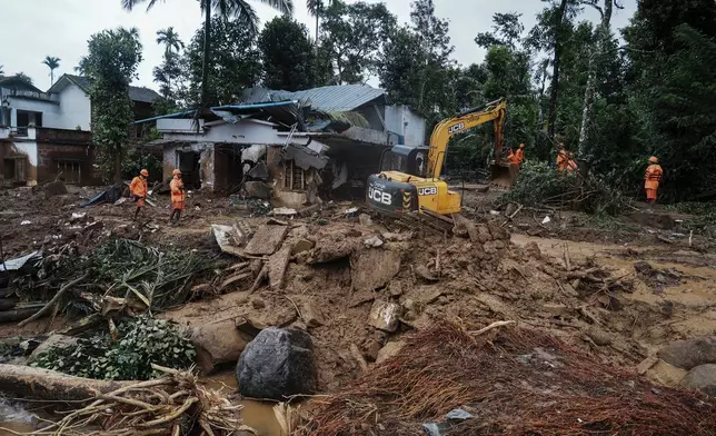 FILE - Rescuers search through mud and debris for a third day after landslides set off by torrential rains in Wayanad district, Kerala state, India, on Aug. 1, 2024. (AP Photo/Rafiq Maqbool, File)