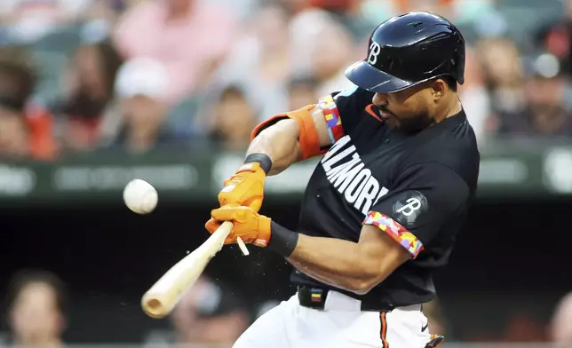 Baltimore Orioles' Anthony Santande hits a single during the first inning of a baseball game against the Houston Astros, Friday, Aug. 23, 2024, in Baltimore. (AP Photo/Daniel Kucin Jr.)