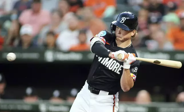 Baltimore Orioles' Jackson Holliday strikes out swinging during the second inning of a baseball game against the Houston Astros, Friday, Aug. 23, 2024, in Baltimore. (AP Photo/Daniel Kucin Jr.)