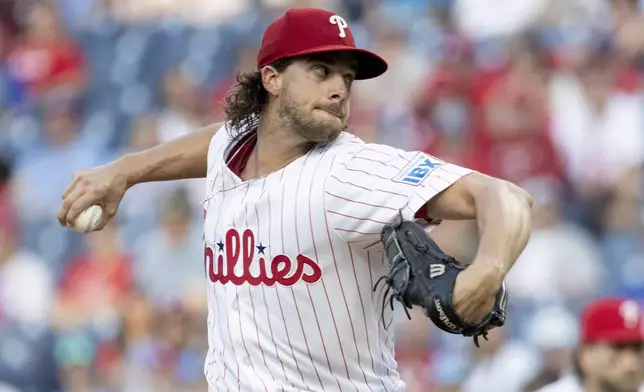 Philadelphia Phillies pitcher Aaron Nola throws in the first inning of a baseball game against the Houston Astros, Tuesday, Aug. 27, 2024, in Philadelphia. (AP Photo/Laurence Kesterson)