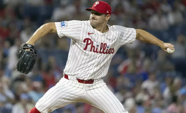 Philadelphia Phillies pitcher Tanner Banks throws during the ninth inning of a baseball game against the Houston Astros, Tuesday, Aug. 27, 2024, in Philadelphia. (AP Photo/Laurence Kesterson)