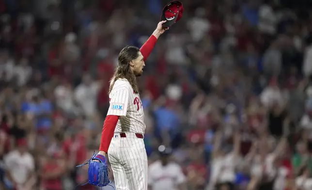 Philadelphia Phillies pitcher Matt Strahm reacts after outfielder Johan Rojas caught a line out by Houston Astros' Yainer Diaz during the 10th inning of a baseball game, Monday, Aug. 26, 2024, in Philadelphia. (AP Photo/Matt Slocum)