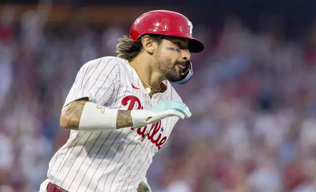 Philadelphia Phillies' Nick Castellanos runs the bases after hitting a three run homer in the third inning of a baseball game against the Houston Astros, Tuesday, Aug. 27, 2024, in Philadelphia. (AP Photo/Laurence Kesterson)