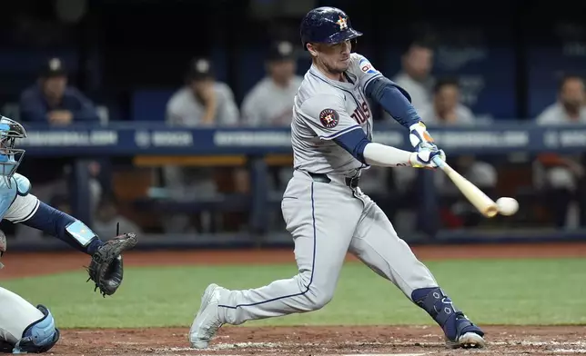 Houston Astros' Alex Bregman lines a double off Tampa Bay Rays starting pitcher Shane Baz during the third inning of a baseball game Tuesday, Aug. 13, 2024, in St. Petersburg, Fla. (AP Photo/Chris O'Meara)