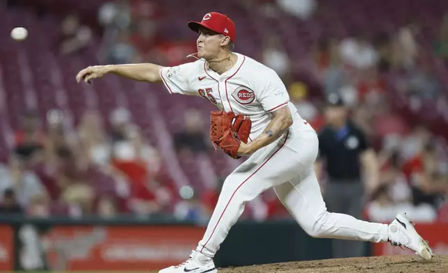 Cincinnati Reds relief pitcher Casey Legumina throws against the Oakland Athletics during the eighth inning of a baseball game, Tuesday, Aug. 27, 2024, in Cincinnati. (AP Photo/Jay LaPrete)