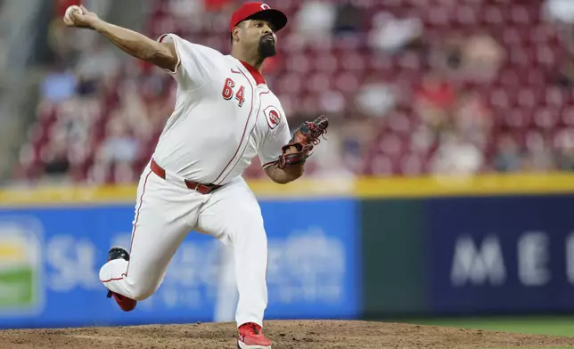 Cincinnati Reds relief pitcher Tony Santillan throws against the Oakland Athletics during the sixth inning of a baseball game, Tuesday, Aug. 27, 2024, in Cincinnati. (AP Photo/Jay LaPrete)