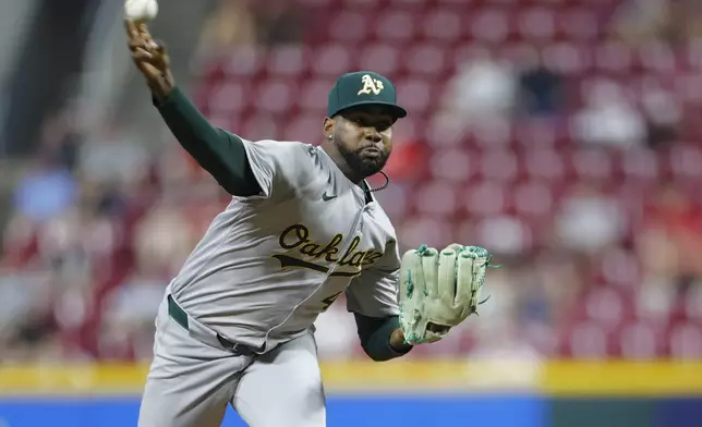 Oakland Athletics relief pitcher Michel Otanez throws against the Cincinnati Reds during the sixth inning of a baseball game, Tuesday, Aug. 27, 2024, in Cincinnati. (AP Photo/Jay LaPrete)