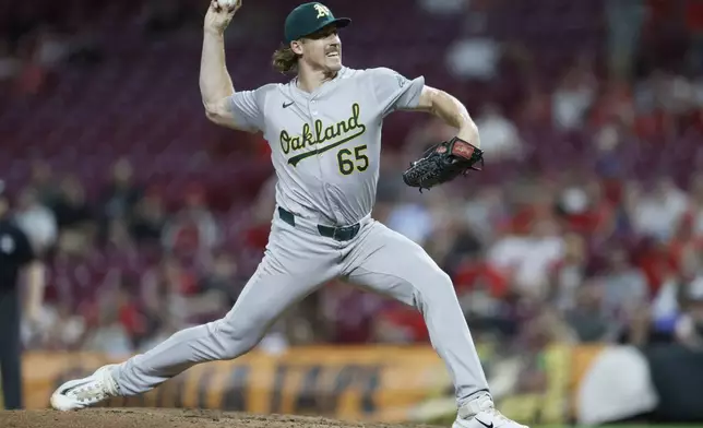 Oakland Athletics relief pitcher Tyler Ferguson throws against the Cincinnati Reds during the eighth inning of a baseball game, Tuesday, Aug. 27, 2024, in Cincinnati. (AP Photo/Jay LaPrete)