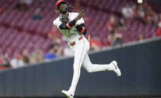 Cincinnati Reds shortstop Elly De La Crux throws out Oakland Athletics' Daz Cameron during the seventh inning of a baseball game, Tuesday, Aug. 27, 2024, in Cincinnati. (AP Photo/Jay LaPrete)