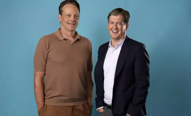 Actor-executive producer Vince Vaughn, left, and creator-executive producer Bill Lawrence, of the Apple TV+ series "Bad Monkey," pose for a portrait at the Four Seasons Hotel, Tuesday, Aug. 6, 2024, in Los Angeles. (AP Photo/Chris Pizzello)