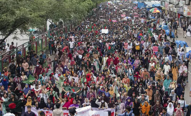 People participate in a protest march against Prime Minister Sheikh Hasina and her government to demand justice for the victims killed in the recent countrywide deadly clashes, in Dhaka, Bangladesh, Saturday, Aug. 3, 2024. (AP Photo/Rajib Dhar)