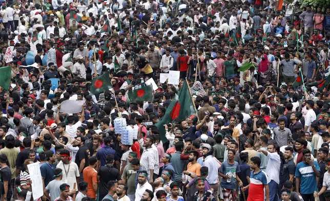 People participate in a rally against Prime Minister Sheikh Hasina and her government demanding justice for the victims killed in the recent countrywide deadly clashes, in Dhaka, Bangladesh, Sunday, Aug. 4, 2024. (AP Photo/Rajib Dhar)