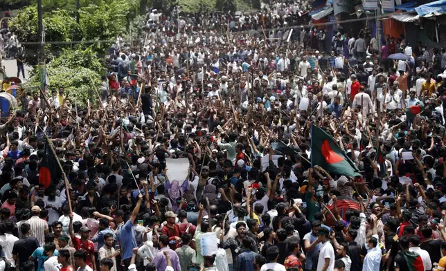 People participate in a rally against Prime Minister Sheikh Hasina and her government demanding justice for the victims killed in the recent countrywide deadly clashes, in Dhaka, Bangladesh, Sunday, Aug. 4, 2024. (AP Photo/Rajib Dhar)