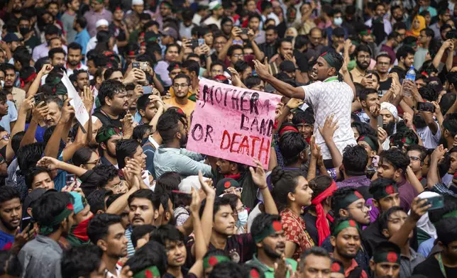 People participate in a protest march against Prime Minister Sheikh Hasina and her government to demand justice for the victims killed in the recent countrywide deadly clashes, in Dhaka, Bangladesh, Saturday, Aug. 3, 2024. (AP Photo/Rajib Dhar)