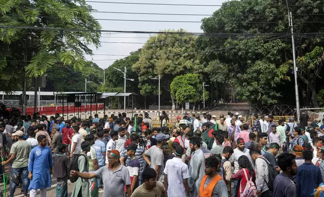 Protesters block the road in front of the former residence of Sheikh Mujibur Rahman, father of the ousted Prime Minister Sheikh Hasina, on his death anniversary in Dhaka, Bangladesh, Thursday, Aug. 15, 2024. (AP Photo/Rajib Dhar)