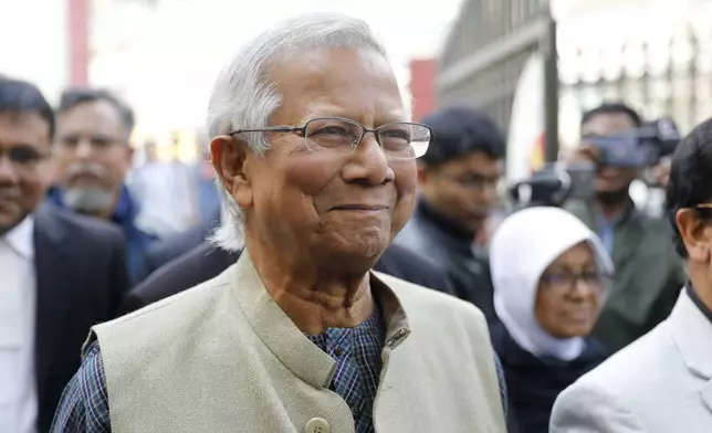 FILE- Nobel Peace Prize laureate Muhammad Yunus smiles as he arrives to appear before a labor court in Dhaka, Bangladesh, Sunday, Jan. 28, 2024. (AP Photo/Mahmud Hossain Opu, File)