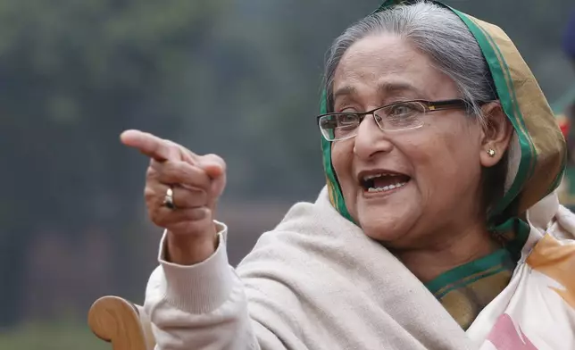 FILE- Bangladesh's Prime Minister Sheikh Hasina gestures as she speaks during a press conference in Dhaka, Bangladesh, Monday, Jan. 6, 2014. Hasina resigned on Monday, June 5, 2024, ending 15 years in power as thousands of protesters defied a military curfew and stormed her official residence. (AP Photo/Rajesh Kumar Singh, File)