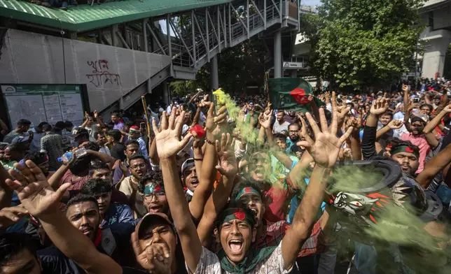 Protesters shout slogans as they celebrate Prime Minister Sheikh Hasina's resignation, in Dhaka, Bangladesh, Monday, Aug. 5, 2024. (AP Photo/Rajib Dhar)