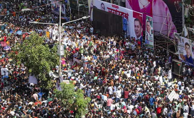 People gather in front of the Bangladesh Nationalist Party (BNP) headquarters during a protest rally in Dhaka, Bangladesh, Wednesday, Aug. 7, 2024. (AP Photo/Rajib Dhar)