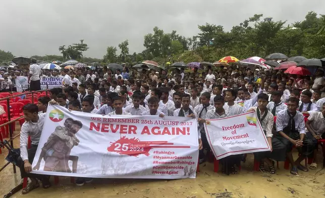 Hundreds of Rohingyas gather to demand safe return to Myanmar's Rakhine state as they mark the seventh anniversary of their exile from Myanmar at their refugee camp at Kutupalong in Cox's Bazar district, Bangladesh, Sunday, Aug. 25, 2024. (AP Photo/ Shafiqur Rahman)