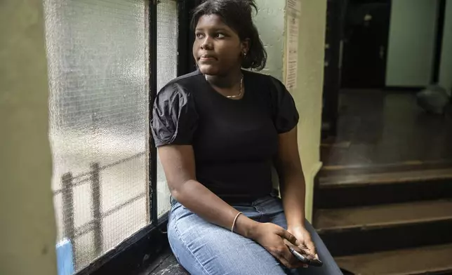 Mia Hall, 14, poses for a portrait in her neighborhood park on Thursday, Aug. 29, 2024, in Bronx borough of New York. (AP Photo/Brittainy Newman)