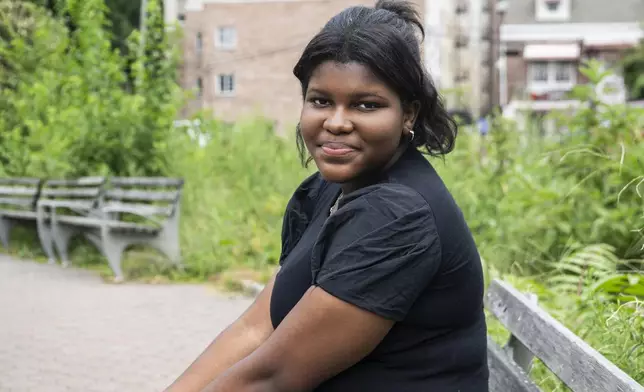 Mia Hall, 14, poses for a portrait in her neighborhood park on Thursday, Aug. 29, 2024, in Bronx borough of New York. (AP Photo/Brittainy Newman)