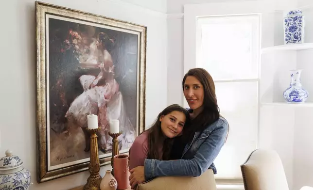 Scarlett Goddard Strahan, 11, and her mom Anna Goddard pose for a portrait at their home on Tuesday, Aug. 20, 2024, in Sacramento, Calif. (AP Photo/Juliana Yamada)