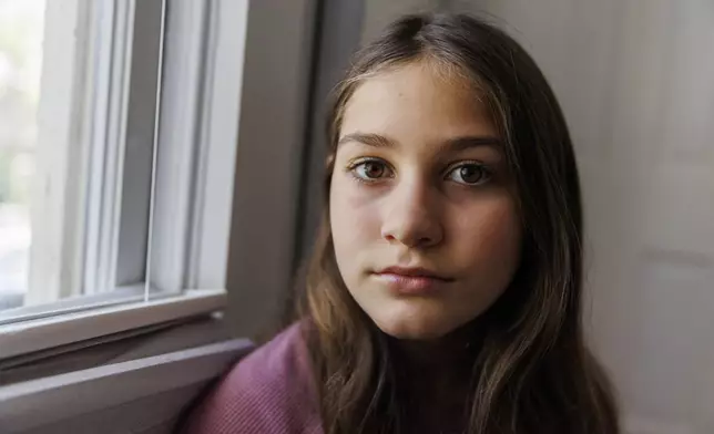 Scarlett Goddard Strahan, 11, poses for a portrait at her home on Tuesday, Aug. 20, 2024, in Sacramento, Calif. (AP Photo/Juliana Yamada)