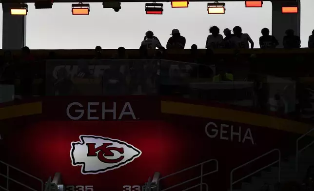 Fans watch in the stands during the first half of an NFL preseason football game between the Kansas City Chiefs and the Chicago Bears Thursday, Aug. 22, 2024, in Kansas City, Mo. (AP Photo/Charlie Riedel)