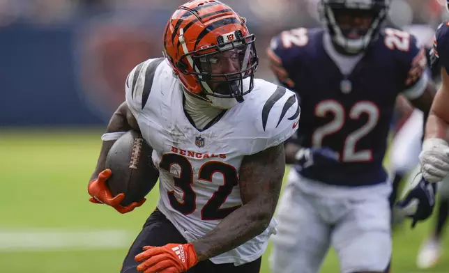 Cincinnati Bengals running back Trayveon Williams (32) carries the ball during the first half of an NFL preseason football game against the Chicago Bears, Saturday, Aug. 17, 2024, at Soldier Field in Chicago. (AP Photo/Erin Hooley)