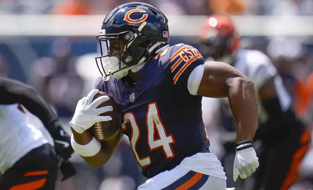 Chicago Bears running back Khalil Herbert (24) runs with the ball during the first half of an NFL preseason football game against the Cincinnati Bengals, Saturday, Aug. 17, 2024, at Soldier Field in Chicago. (AP Photo/Erin Hooley)