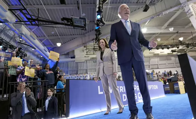 Democratic presidential nominee Vice President Kamala Harris, left, and President Joe Biden depart after speaking about the administration's efforts to lower prescription drug costs during an event at Prince George's Community College in Largo, Md., Thursday, Aug. 15, 2024. (AP Photo/Susan Walsh)