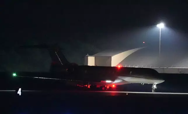 A plane carrying reporter Evan Gershkovich, Alsu Kurmasheva and Paul Whelan lands at Andrews Air Force Base, Md., following their release as part of a 24-person prisoner swap between Russia and the United States, Thursday, Aug. 1, 2024. (AP Photo/Alex Brandon)